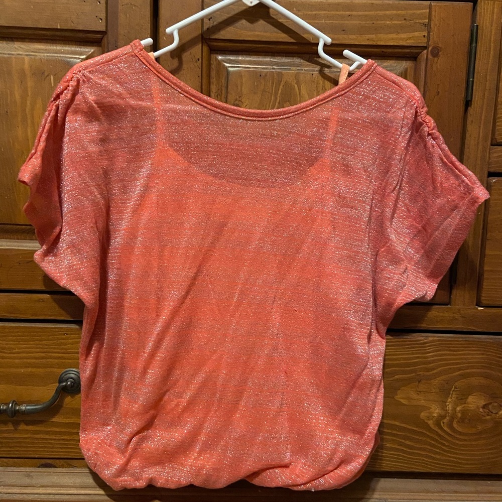 Orange Top with tank top under.